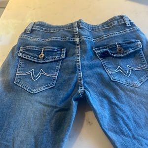 Jeans with etched pockets